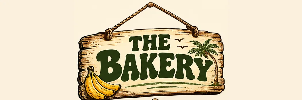 Weathered wooden hanging sign: THE BAKERY with banana bunch and palm